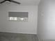 Bedroom features a window with exterior view at 940 Virginia St # 107, Dunedin, FL 34698