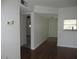 Open floor plan with dining area and view of kitchen at 940 Virginia St # 107, Dunedin, FL 34698