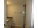 Clean bathroom with tiled shower and granite countertop at 940 Virginia St # 107, Dunedin, FL 34698