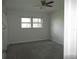 Spacious bedroom with neutral carpeting and large windows at 940 Virginia St # 107, Dunedin, FL 34698