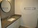 Updated bathroom with granite countertop at 940 Virginia St # 107, Dunedin, FL 34698
