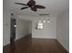 Spacious living room with hardwood floors and ceiling fan at 940 Virginia St # 107, Dunedin, FL 34698