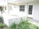 Unit exterior with private entrance and landscaping at 940 Virginia St # 107, Dunedin, FL 34698