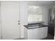 Modern kitchen with stainless steel appliances and granite countertops at 940 Virginia St # 107, Dunedin, FL 34698