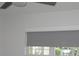 Bright bedroom with gray window shade and ceiling fan at 940 Virginia St # 107, Dunedin, FL 34698