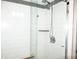 Updated shower with tiled walls and dual shower heads at 940 Virginia St # 107, Dunedin, FL 34698