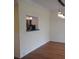 Kitchen pass-through with modern appliances and granite countertops at 940 Virginia St # 107, Dunedin, FL 34698