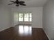 Living room with hardwood floors and view at 940 Virginia St # 107, Dunedin, FL 34698