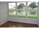 Bright sunroom with pond view at 940 Virginia St # 107, Dunedin, FL 34698