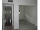 Bedroom with mirrored closet and view of hallway at 940 Virginia St # 107, Dunedin, FL 34698