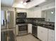 Modern kitchen with stainless steel appliances at 940 Virginia St # 107, Dunedin, FL 34698