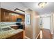 Well-equipped kitchen with granite countertops and wood cabinets at 6021 Bahia Del Mar Cir # 439, St Petersburg, FL 33715
