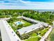 Aerial view of waterfront community with pool and lush landscaping at 650 Pinellas Point S Dr # 128, St Petersburg, FL 33705