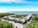 Aerial view showing waterfront property and ample parking at 650 Pinellas Point S Dr # 128, St Petersburg, FL 33705