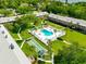 Complex with pool, shuffleboard, and lush lawn at 650 Pinellas Point S Dr # 128, St Petersburg, FL 33705