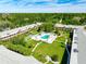 Aerial view of community pool and surrounding green space at 650 Pinellas Point S Dr # 128, St Petersburg, FL 33705