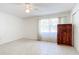 Spacious bedroom with tile floors and large window at 650 Pinellas Point S Dr # 128, St Petersburg, FL 33705