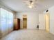 Spacious bedroom with tile floors and ceiling fan at 650 Pinellas Point S Dr # 128, St Petersburg, FL 33705