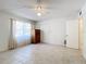 Spacious bedroom with tile floors and ceiling fan at 650 Pinellas Point S Dr # 128, St Petersburg, FL 33705