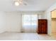 Bright bedroom with tile floors and large window at 650 Pinellas Point S Dr # 128, St Petersburg, FL 33705