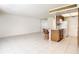 Kitchen with light wood cabinets and breakfast bar at 650 Pinellas Point S Dr # 128, St Petersburg, FL 33705