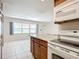 Kitchen with island, stove and microwave at 650 Pinellas Point S Dr # 128, St Petersburg, FL 33705