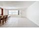 Living room features tile floors and a door to the outside at 650 Pinellas Point S Dr # 128, St Petersburg, FL 33705