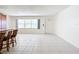 Bright living room with tile floors and view to backyard at 650 Pinellas Point S Dr # 128, St Petersburg, FL 33705