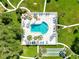 Community pool with surrounding lounge chairs and lush landscaping at 650 Pinellas Point S Dr # 128, St Petersburg, FL 33705