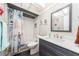 Bathroom with a modern vanity, subway tile in the shower, and nautical decor at 9543 86Th Ave # 9543, Seminole, FL 33777