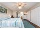 Comfortable bedroom featuring ensuite bathroom access, and closet doors at 9543 86Th Ave # 9543, Seminole, FL 33777