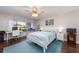 Inviting bedroom featuring a large window, and a dedicated workspace at 9543 86Th Ave # 9543, Seminole, FL 33777
