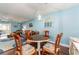 Charming dining area with a round table, comfortable chairs, and a bright window at 9543 86Th Ave # 9543, Seminole, FL 33777