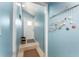 A charming entryway with blue walls, tile floors, and beach-themed decor at 9543 86Th Ave # 9543, Seminole, FL 33777