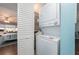 Convenient in-unit laundry area with a stacked washer and dryer and ample storage space at 9543 86Th Ave # 9543, Seminole, FL 33777