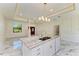 Large kitchen island with marble countertop and double sink at 756 Bowman Ter, Port Charlotte, FL 33953