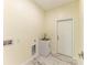 Laundry room with utility sink and marble-look floor at 756 Bowman Ter, Port Charlotte, FL 33953