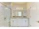 Bathroom with double vanity and marble tile shower at 756 Bowman Ter, Port Charlotte, FL 33953