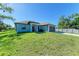 Newly built home with a one-car garage and a spacious front yard at 756 Bowman Ter, Port Charlotte, FL 33953