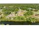 Aerial view of a canal-front home with a large lot at 756 Bowman Ter, Port Charlotte, FL 33953