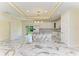 Modern kitchen with white cabinets and marble island at 756 Bowman Ter, Port Charlotte, FL 33953