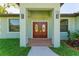 Elegant double front doors with glass accents leading into the home at 756 Bowman Ter, Port Charlotte, FL 33953