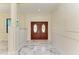 Bright entryway with marble floors and elegant double doors at 756 Bowman Ter, Port Charlotte, FL 33953