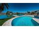 Stunning pool area with canal views and patio at 550 Johns Pass Ave, Madeira Beach, FL 33708