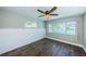 Bright bedroom with water views and ceiling fan at 550 Johns Pass Ave, Madeira Beach, FL 33708
