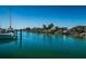 Stunning waterfront view with boats and lush tropical foliage at 550 Johns Pass Ave, Madeira Beach, FL 33708