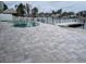 Relaxing pool area with patio and dock access at 550 Johns Pass Ave, Madeira Beach, FL 33708