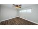 Spacious bedroom with wood floors and ceiling fan at 550 Johns Pass Ave, Madeira Beach, FL 33708