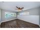 Spacious bedroom with wood flooring and water views at 550 Johns Pass Ave, Madeira Beach, FL 33708