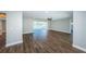 Open concept living room with hardwood floors and access to other rooms at 550 Johns Pass Ave, Madeira Beach, FL 33708